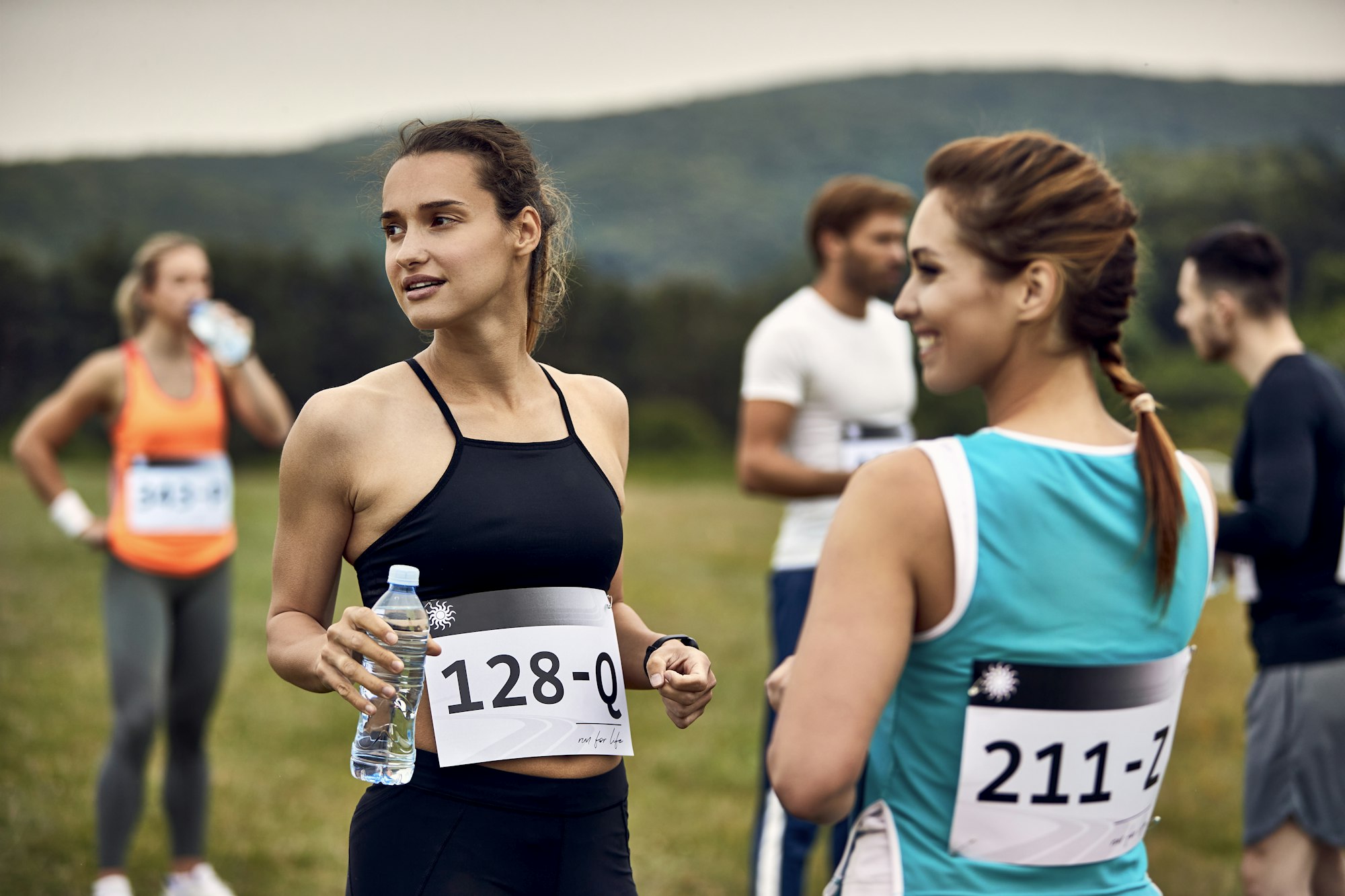 Young marathon runners before the race in nature.